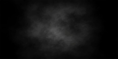 Fototapeta premium Mysterious grey smoke or fog swirls against a dark, atmospheric background, creating an abstract and moody texture.