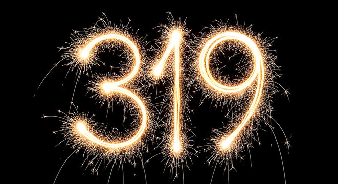 Vibrant firework sparklers forming the year 319 against a dark background, creating a celebratory and futuristic visual effect.