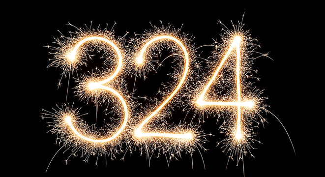 Vibrant sparkler fireworks create a glowing, illuminated number 324 against a dark background, ideal for celebrations or countdowns.
