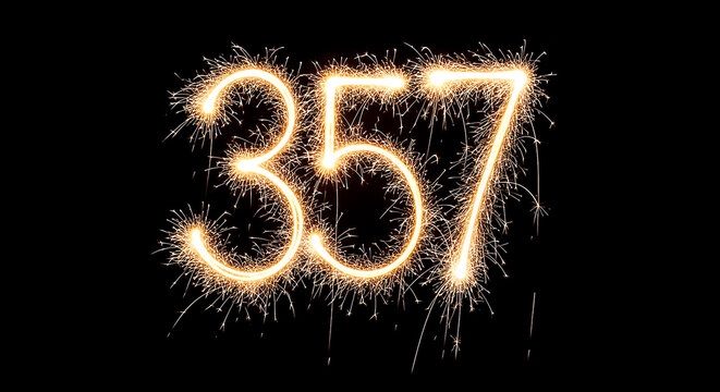 Vibrant sparklers forming the illuminated number 357 against a dark background, creating a festive and celebratory visual effect.
