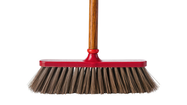 Isolated classic household broom with textured wooden handle and bright red plastic head