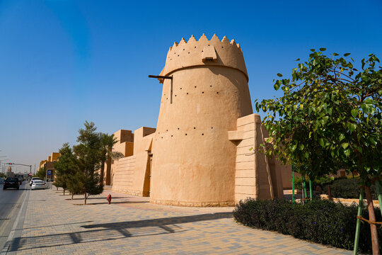 Traditional mud brick watchtower with decorative crenellations in Al Dho historical district, Riyadh, Saudi Arabia