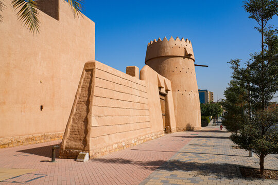 Traditional mud brick watchtower with decorative crenellations in Al Dho historical district, Riyadh, Saudi Arabia