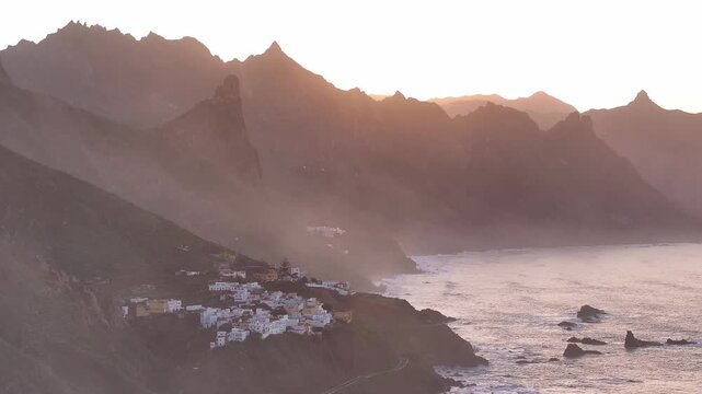 Aerial view of Alm&aacute;ciga village and Roque de las &Aacute;nimas coastline at sunset in Anaga, Tenerife, Canary Islands, Spain