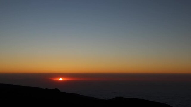 Sunset horizon and cloud inversion in Teide National Park