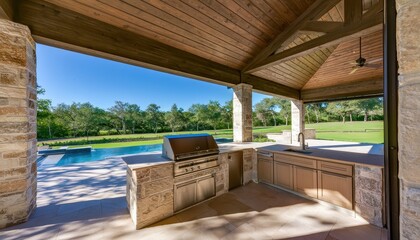 Fototapeta premium A luxurious outdoor kitchen with a pool and patio area in a serene natural setting