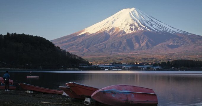 Canoes on shore of lake with beautiful view of mount fuji - wide shot