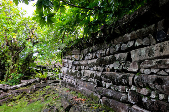 Ancient basalt, coral, stone walls within Nan Madol archaeological site in Pohnpei, Federated States of Micronesia