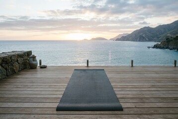 Yoga Mat on Wooden Deck Facing Ocean Sunrise