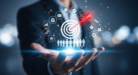 Fototapeta premium Business strategy concept with a hand holding glowing icons and a target audience illustration