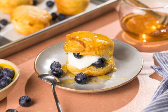 Scone Filled with Blueberry  and Clotted Cream on a plate