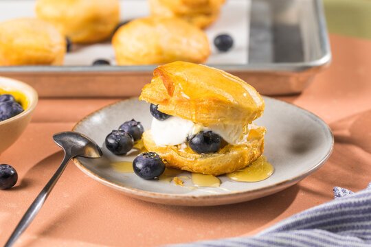 Scone Filled with Blueberry  and Clotted Cream on a plate