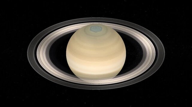Realistic planet Saturn with rings rotating slowly in deep space on black starry background