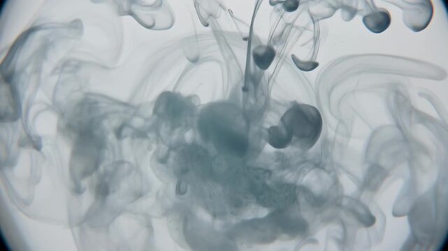 Ink diffusion in water creating abstract patterns
