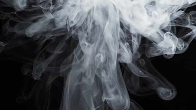 White smoke swirling and rising isolated on solid black background, slow motion