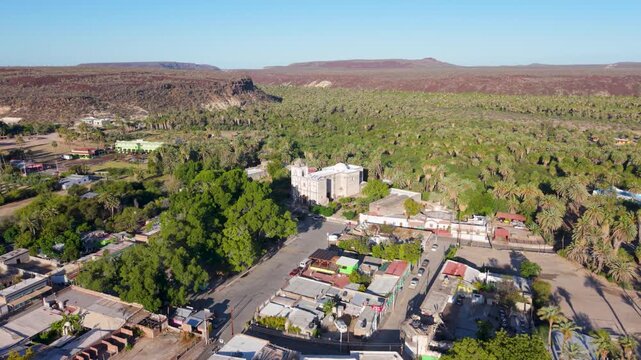 Discover aerial views of Mission Church in San Ignacio, Baja California. Watch the beauty of the oasis town and its surroundings unfold.