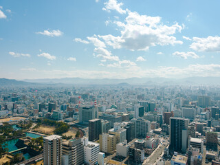 Fototapeta premium Rooftop view of Takamatsu city in Kagawa, Japan under blue sky and clouds