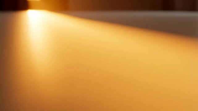 A minimal abstract scene where soft light gradually expands across a clean surface