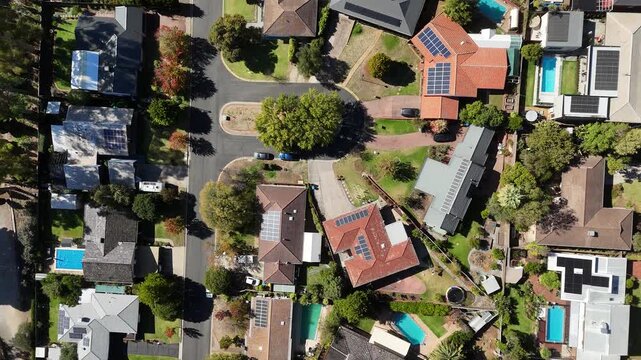 Urrbrae, South Australia &ndash; 4K aerial drone footage of suburban residential houses, tree-lined streets, backyard pools, solar panel rooftops in a peaceful Adelaide foothills neighborhood in Autumn