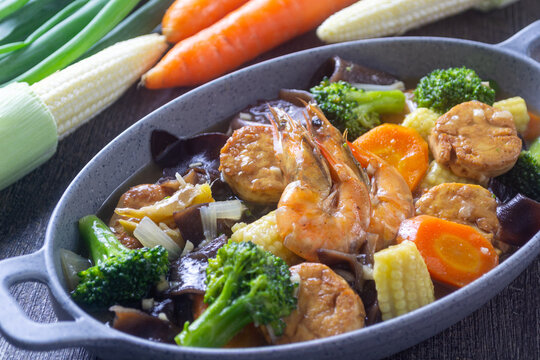 Chinese style sapo tahu seafood and fresh vegetables on a plate