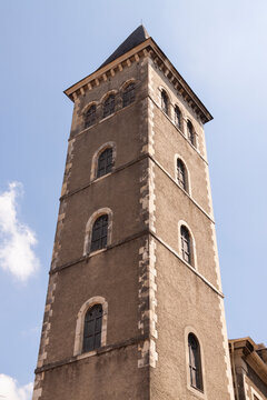 Ancient stone tower stands tall against clear blue sky
