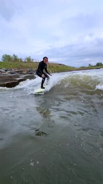 Female surfer drop in off bank River carve surfing made made glassy Benihanas Wave surfing Denver South Platte River Englewood Sheridan Front Range Chatfield reservoir state park run off snow melt