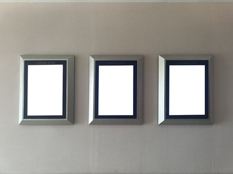 Blank movie poster display on the wall