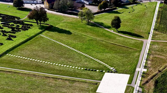 Historic Jelling Churchyard cemetery and mounds within ancient Viking stronghold and UNESCO heritage site in Denmark