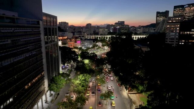 Sunset Skyline In Carioca Aqueduct In Rio De Janeiro In Brazil. Sunset Landscape. Downtown District. Landmark Monument. Sunset Skyline In Carioca Aqueduct In Rio De Janeiro In Brazil.
