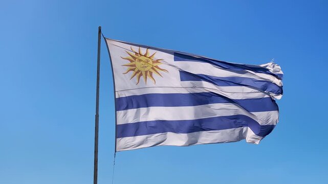 Uruguayan Flag At Punta Del Este In Maldonado Uruguay. Uruguay Flag Scenery. Flag Wave Scene. Patriotic Uruguay Landscape. Uruguayan Flag At Punta Del Este In Maldonado Uruguay.