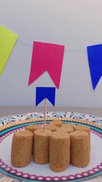 Preparation for Festa Junina - Putting mini traditional flags in the Pa&ccedil;oquinhas