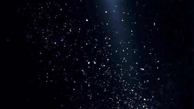 Cinematic dark background featuring floating glowing particles and a subtle blue light beam effect.