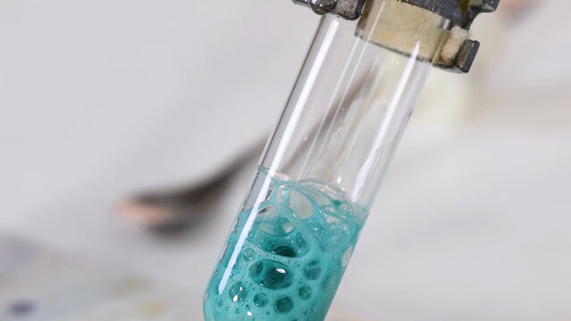 Chemical Reaction of Copper Carbonate and Sulfuric Acid in a Test Tube
