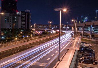 Fototapeta premium Highway Light Trails at Night – Long Exposure Urban Photography