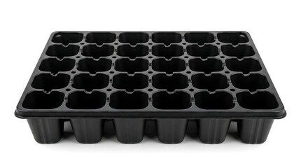 Naklejka premium A black seed starter tray with multiple small pots sits on a white surface indoors.