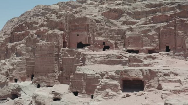 Ancient rock-cut tombs on sandstone hills of Petra