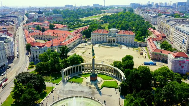 Vienna, Austria. Heroes' Monument of the Red Army, a sweeping semi-circular marble colonnade framing a towering bronze soldier, Drone footage over Schwarzenbergplatz. Drone footage, Departure of the 