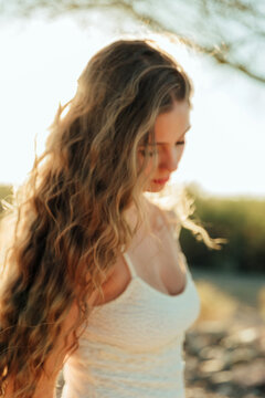 profile of a young woman with long hair
