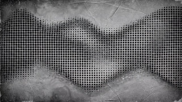 A close-up view of a metallic mesh surface with a wavy pattern on an industrial background with smoke