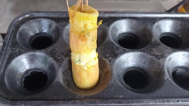 closeup sausage with omelet on grilled