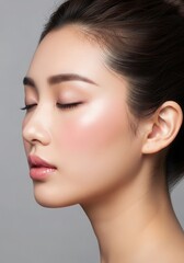 Naklejka premium Serene asian woman portrait close up of peaceful face with flawless skin and subtle makeup