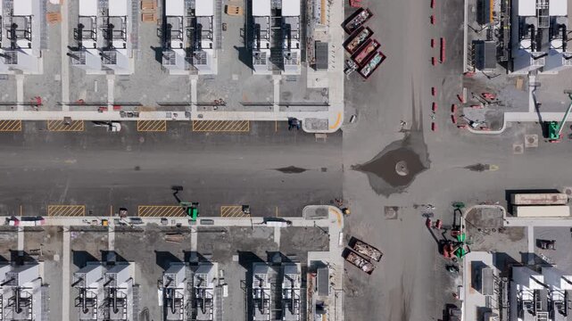 Aerial view of an industrial construction site with rows of white equipment units and heavy machinery in New Carlisle, Indiana, United States.