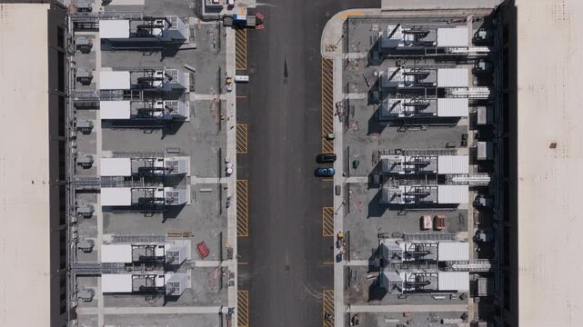 Aerial view of rows of industrial power generation units and cooling systems at a data center facility in New Carlisle, Indiana, United States