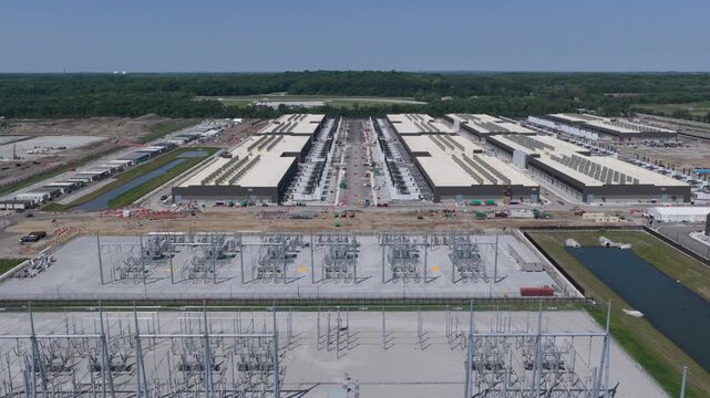 Aerial view of the data ai center construction site, buildings and power station, energy source in the foreground