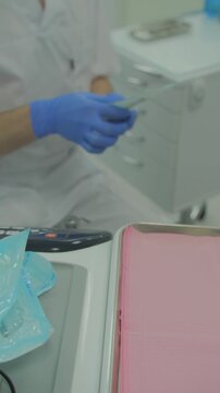 Tight shot of a tooth cavity, removed by a dentals burr during a restorative procedure,  a dental practitioner drilling into a damaged tooth to treat a carious lesion, dentist working