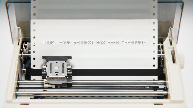 Old Dot Matrix Printer Printing YOUR LEAVE REQUEST HAS BEEN APPROVED Text on continuous white paper Close Up view.