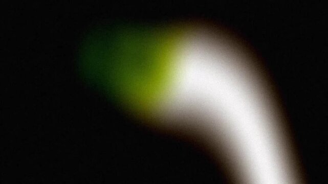 Abstract Green Light Leak Shimmering With Heavy Vintage Grain Over Cinematic Dark Background For Retro Film Aesthetic