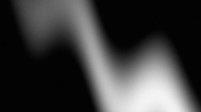 Monochromatic grainy light waves pulsing and shifting through a minimalist dark void with a cinematic film grain lo-fi aesthetic
