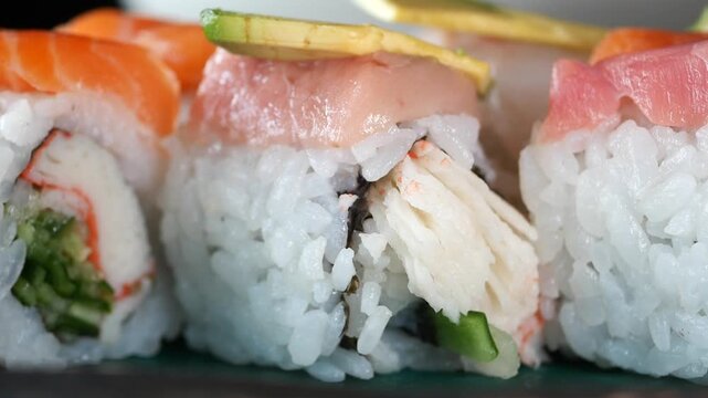 Sushi making process in a busy kitchen during lunch hour