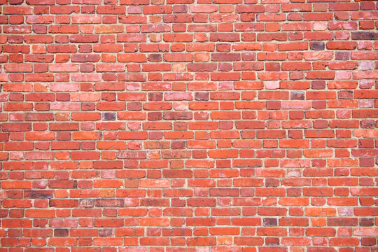 Antique bricks wall background, red brick masonry surface. Texture of bricks wall. Clinker brickwall backdrop. Brickwall wallpaper. Grunge, wall pattern.